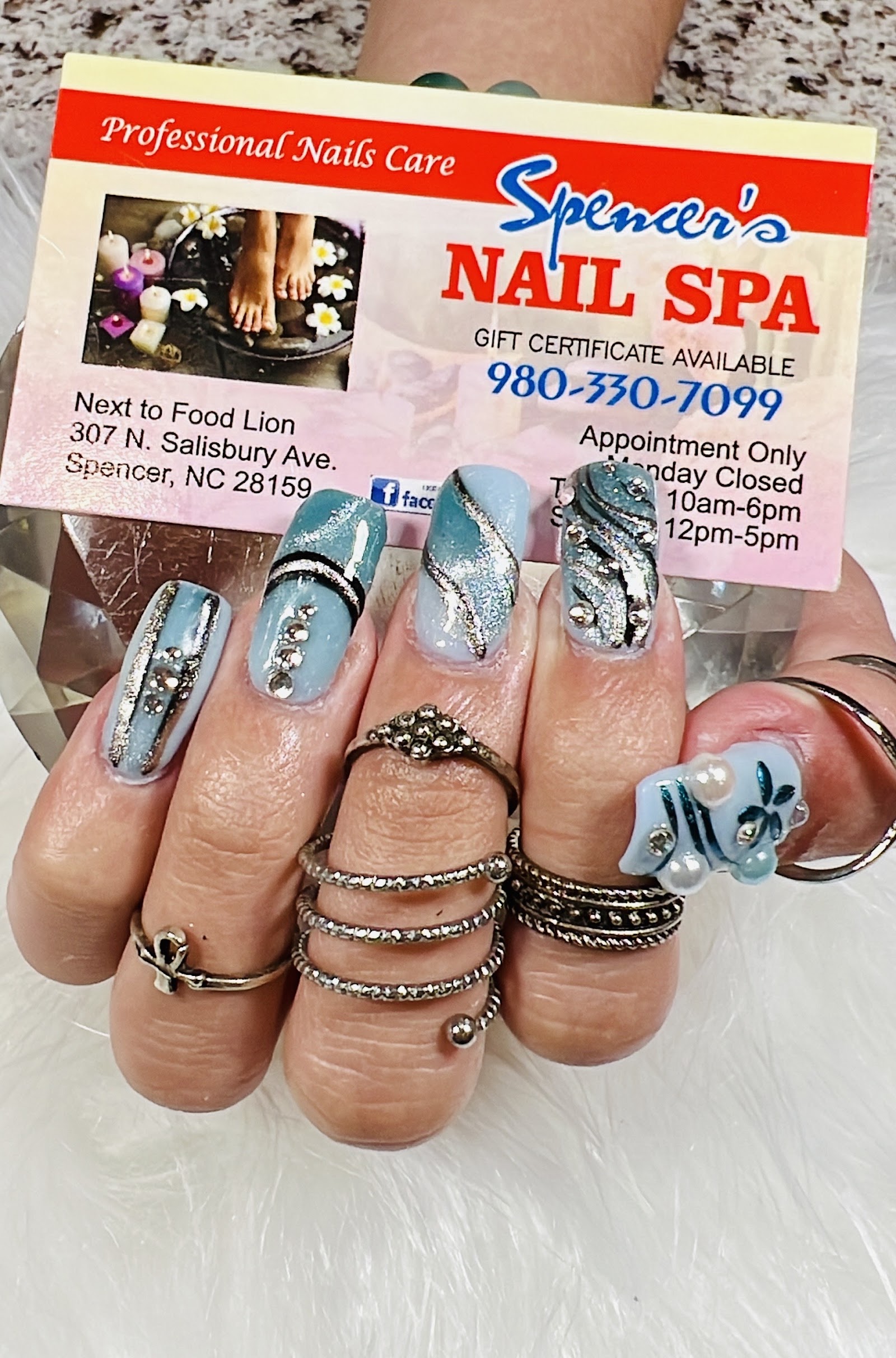 Spencer's Nails & Spa logo
